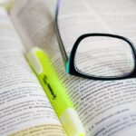 Open book with eye glasses