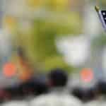 Veteran waving a small american flag