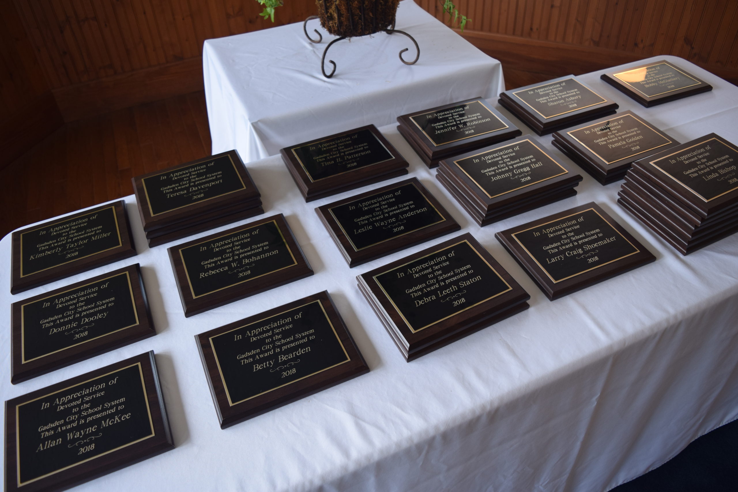 Table with retirement plaques