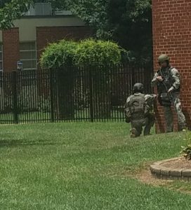 Armed first responders outside of a school