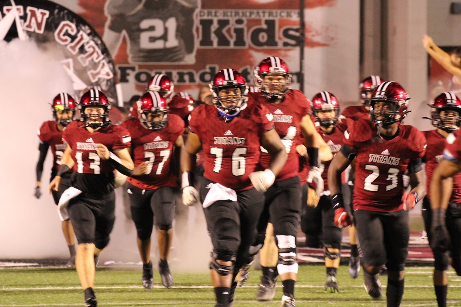 Football Players Running with Smoke